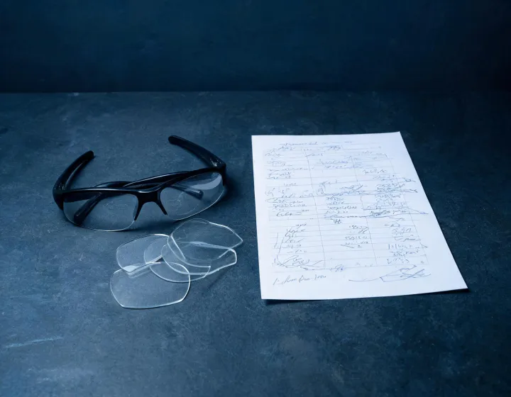 Unlabeled shooting glasses beside a written sourcing brief